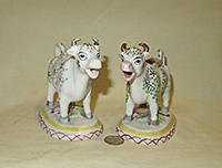 2 Kent style cow creamers with small flowers and leaves, front
