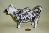 Kent stryle cow creamer, no base, with black and a bit of brown marks