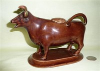 Caramel colored cow creamer with much restoration