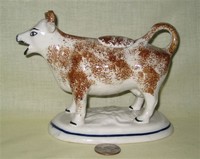 Kent style cow creamer with brown sponging