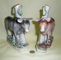 Front view, Grey and brown bull spill vase cow creamers
