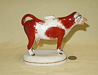 Reddish-br spotted and orange nosed Swansea cow creamer 