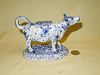 Long necked cow creamer with blue flowers, right