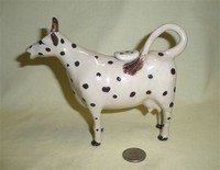 White cow creamer with black spots and no base