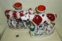 Pair of large cow creamer spill vases with sitting milkmaids