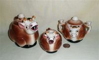 Small brown and white cow teapot set