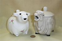 One winsome and one strange cow teapot