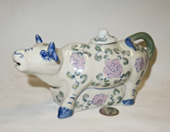 Chinese ceramic cow teapot with blue trim and pink flowers