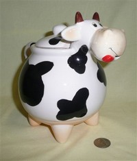 Bulbous nosed cow teapot with pointy legs