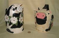 2 cow watering cans