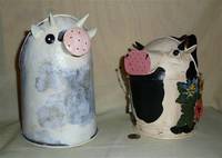 2 cow watering cans